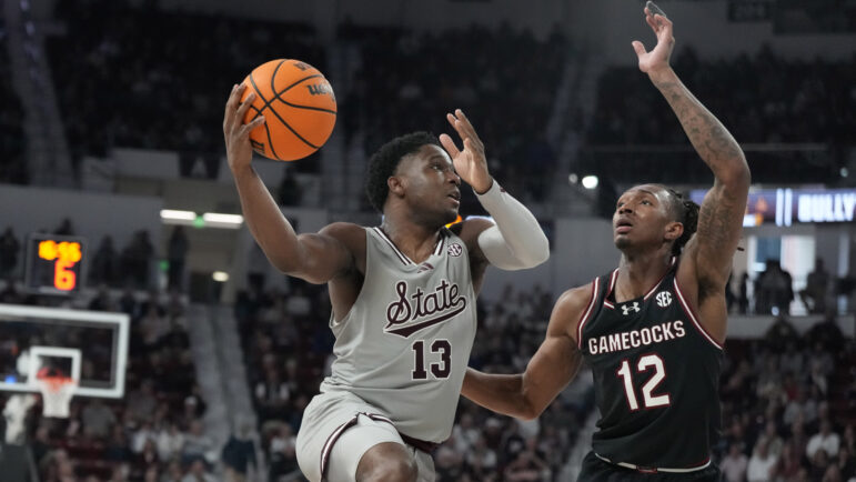 Mississippi State guard Josh Hubbard (13) attempts a layup past South Carolina guard Zachary Davis (12) during the second half of an NCAA college basketball game, Saturday, March 9, 2024, in Starkville, Miss.