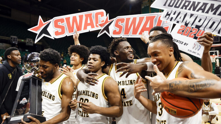 Grambling State players celebrate their win over Texas Southern after an NCAA college basketball game in the championship of the Southwestern Athletic Conference tournament, Saturday, March 16, 2024, in Birmingham, Ala. (AP Photo/Butch Dill)