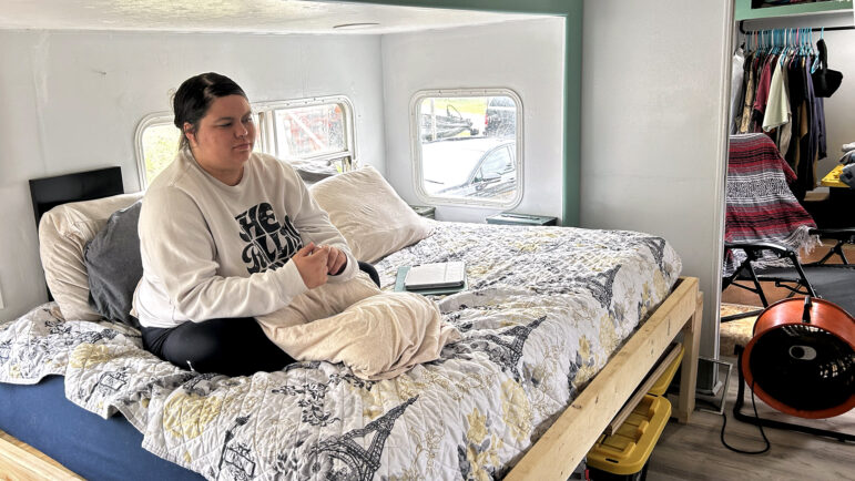 Gabbie Price sits on her bed in her camp home in Moody, Alabama, on March 15, 2024.