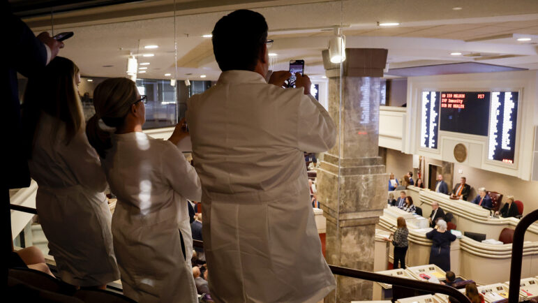 Doctors from the Alabama Fertility Clinic take photos of the votes as the debate over SB159 (IVF Fertility Bill) in the state House Chambers is voted on, Wednesday, March 6, 2024, in Montgomery, Ala.