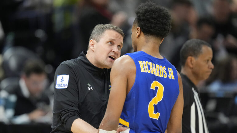 McNeese State head coach Will Wade, left, speaks with guard DJ Richards Jr. (2) during the second half of a first-round college basketball game against Gonzaga in the NCAA Tournament in Salt Lake City, Thursday, March 21, 2024.
