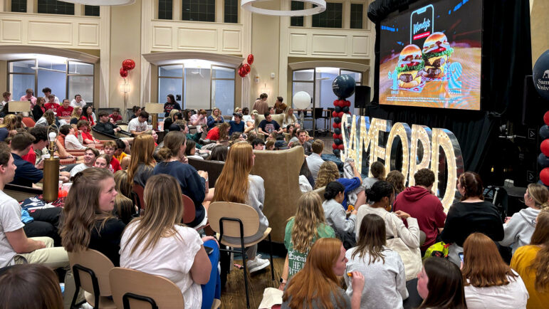 Samford University students gather at The HUB student center to watch Samford's basketball game against the University of Kansas in the first round of the NCAA Tournament on March 21, 2024, in Homewood, Alabama.