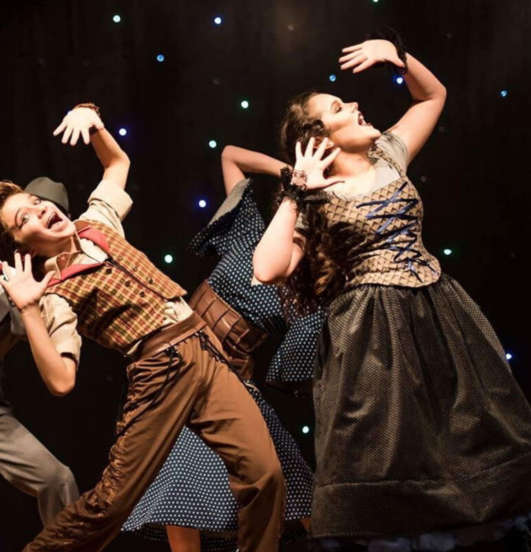 Lily Kate dances and sings along with fellow actors during a performance of The Last Five Years.