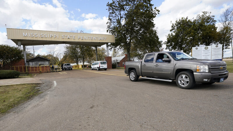 In this file photo, traffic leaves the front gate to the Mississippi State Penitentiary in Parchman, Miss., Nov. 17, 2021.