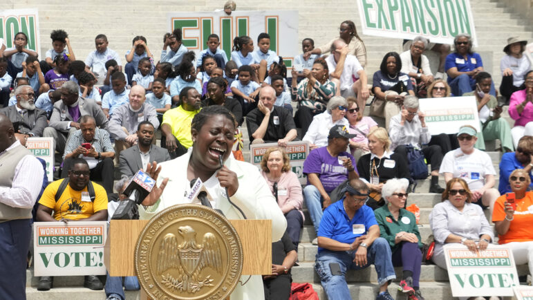 Azia Wiggins, an organizer with Working Together Mississippi, opens the Mississippi Medicaid Expansion Rally at the Mississippi State Capitol in Jackson, with a song, Tuesday, April 16, 2024.
