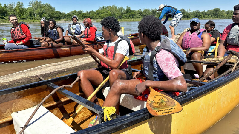 Teenagers and younger kids with Spring Initiative, an after-school program in Clarksdale, Mississippi, row down the Mississippi River while on a canoeing trip in Helena, Arkansas on Saturday, May 11, 2024.