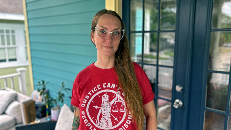 Meghan Matt stands on the front porch of her New Orleans home on June 12, 2024.