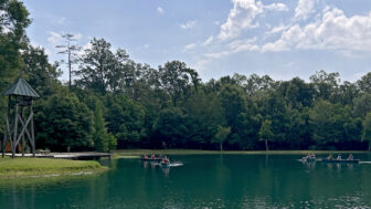Campers paddle canoes on the lake at Camp Istrouma in Greenwell Springs, Louisiana, on June 12, 2024.