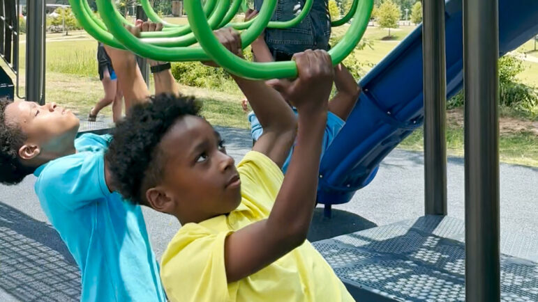 A group of children with the Black Homeschoolers of Birmingham group play on the playground at Wald Park in Birmingham, Alabama, on June 14, 2024.