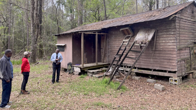 Franklin Tate and a group of archeologists survey his family's property that was lost to time in Little River, Alabama.