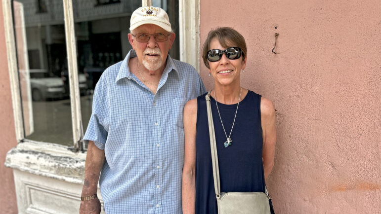 Stephen and Rhonda Bass stand in the shade on Bourbon Street in New Orleans on June 26, 2024.