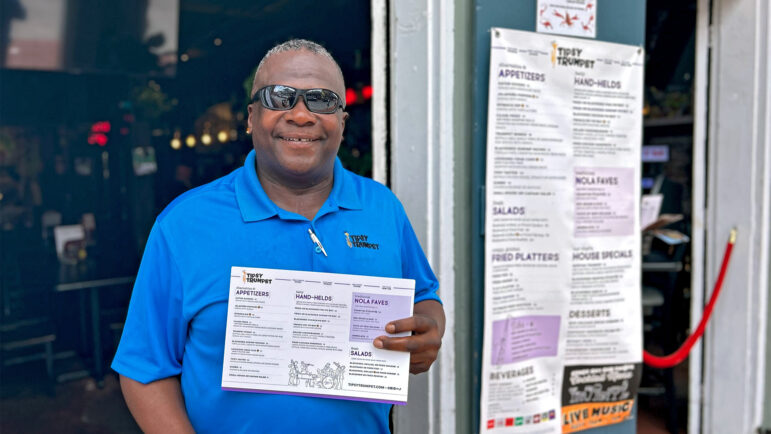 Walt McDaniel mans the door at the Tipsy Trumpet restaurant and bar on Bourbon Street in New Orleans on June 26, 2024.