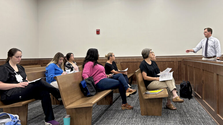 Lauderdale County Assistant District Attorney Cory Griffin explains courtroom proceedings to nurses training to become sexual assault nurse examiners in Meridian, Mississippi, on July 12, 2024.