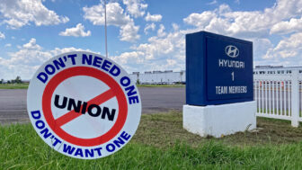 Anti-union signs stand at the entrances to the Hyundai plant in Montgomery, Alabama. July 11, 2024.