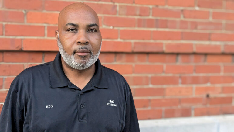 Hyundai worker Robert Strozer stands outside of the SpringHill Suites in downtown Montgomery, Alabama on June 23, 2024.