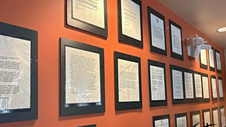 As part of the installation, letters are displayed from a variety of stakeholders who request clemency for Gary Brown, whom Alabama executed in 2003.