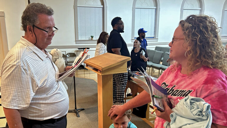 Keith Lowhorne talks with Donna Standridge in the chapel of Locust Grove Baptist Church in New Market, Alabama, on August 22, 2024.