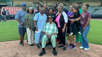 Bill Greason (center) is surrounded by his family for a photo after his 100th birthday celebration at Rickwood Field in Birmingham, Alabama.