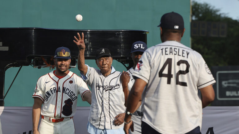 Former Negro Leagues player Bill Greason throws out the first pitch before the start of a baseball game between the St. Louis Cardinals and the San Francisco Giants at Rickwood Field, Thursday, June 20, 2024, in Birmingham, Ala.