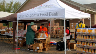 Volunteers help patrons of Shiloh Primitive Baptist Church’s mobile food pantry in Lowndesboro, Alabama, on Aug 22. 2024.