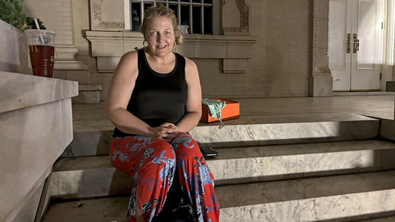 Blair sits on the steps of a church in Birmingham, Alabama.