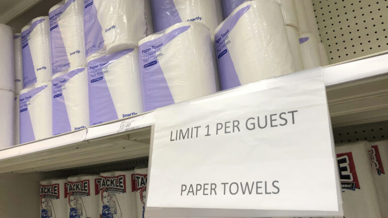 A sign indicates a limit on purchases of paper towels in a Target store in this file photograph taken Tuesday, Nov. 10, 2020, in Sheridan, Colo.