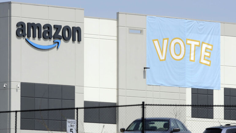 a banner encouraging workers to vote in labor balloting is shown at an Amazon warehouse in Bessemer.