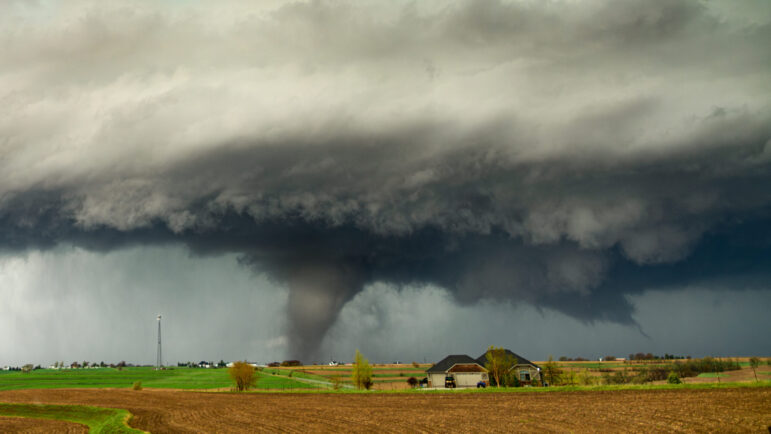 destructive tornado near a farm house