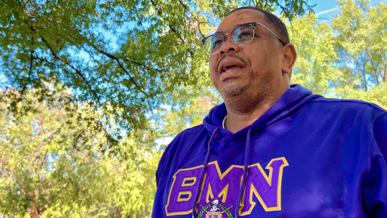 Chris Anderson, a former Birmingham homicide detective, speaks to a reporter in the city's Kelly Ingram Park on Oct. 19, 2024.