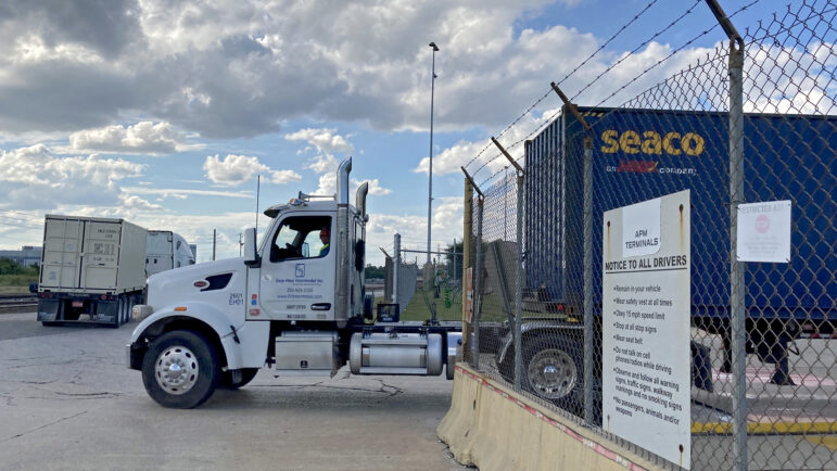 A truck exits the Port of Mobile on September 30, 2024, the day before a dockworkers' strike began.