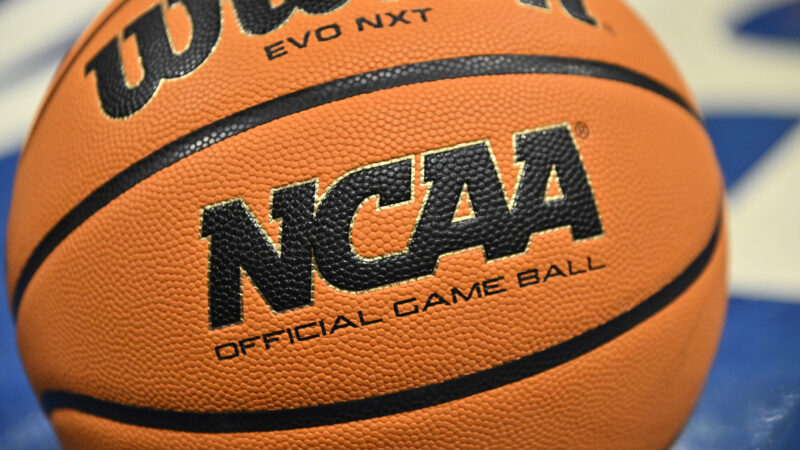 An official game ball sits on the court during the second half of an NCAA college basketball game between Southern California and UCLA.