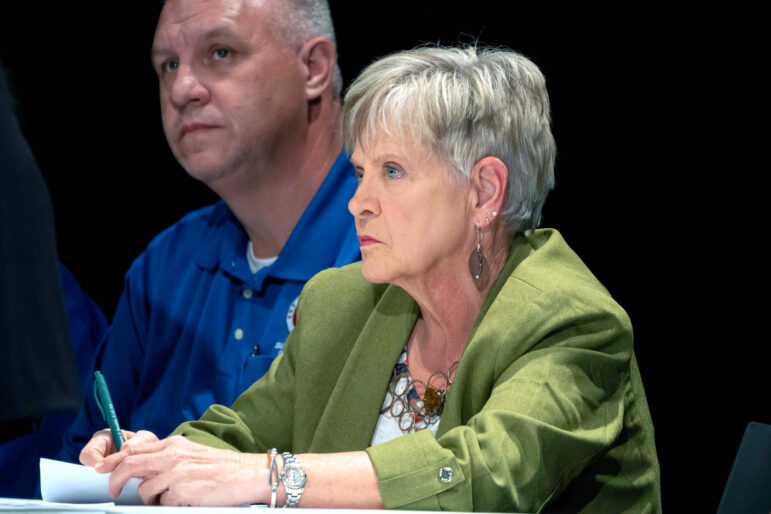 Kathy Love, director of the Alabama Surface Mining Commission, listens during a discussion highlighting the consequences of longwall coal mining at Oak Grove High School