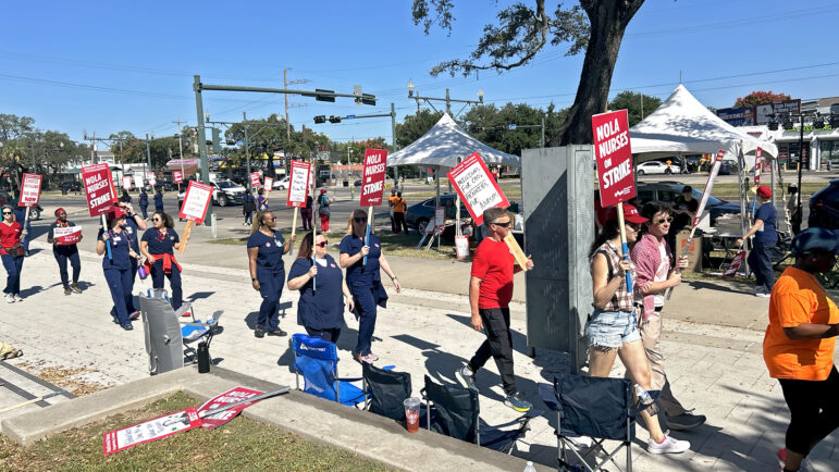 UMC Nurses hold up picket signs and march during their one-day strike on October 25, 2024.