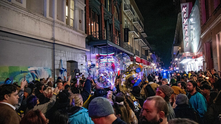 Hundreds gather for a vigil on the corner of Bourbon and Canal streets in New Orleans on Saturday, Jan. 4, 2025, honoring the 14 people killed and 35 injured in the New Year’s Day terrorist attack.