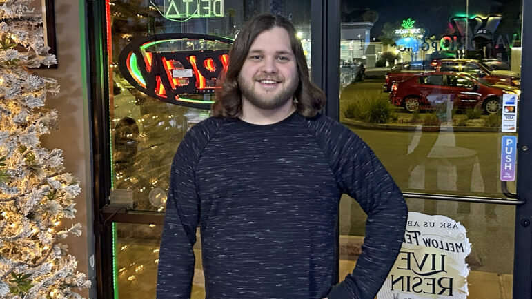 Trevor Malosh stands at the entrance of his family’s store in Ocean Springs, Mississippi, on Dec. 20, 2024.