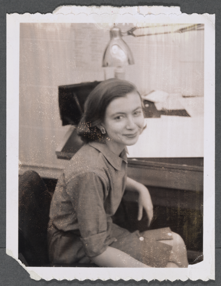 Photograph of Joan Didion in the Vogue Art Department, c. 1958