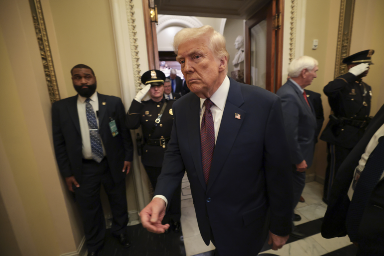 President Trump leaves the chamber after addressing a joint session of Congress on Tuesday. The administration is locked in a legal battle over the firing of the head of a federal watchdog agency.