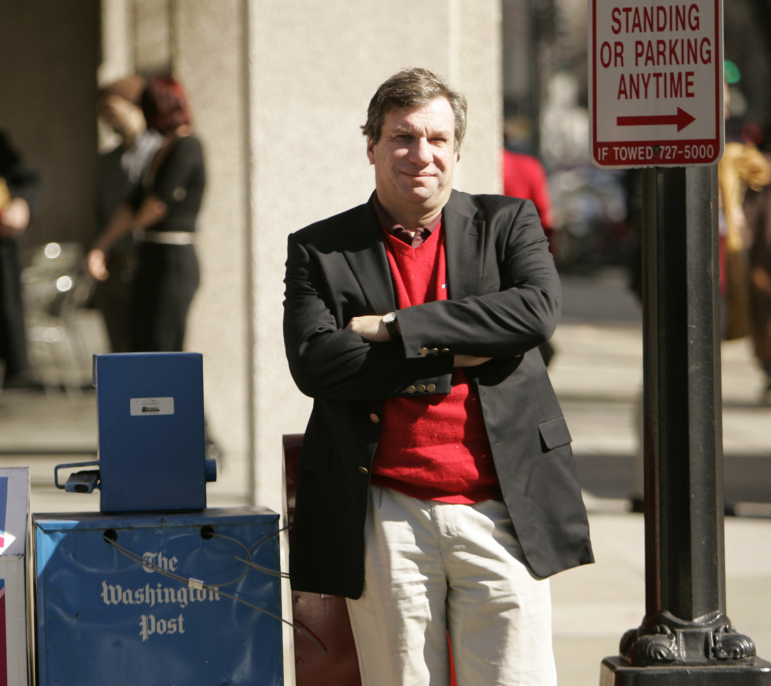 Sports writer and author John Feinstein poses in Washington, Feb. 28, 2006.