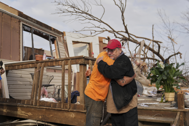 Tim Scott, right, gets a hug from friend Jorden Harris
