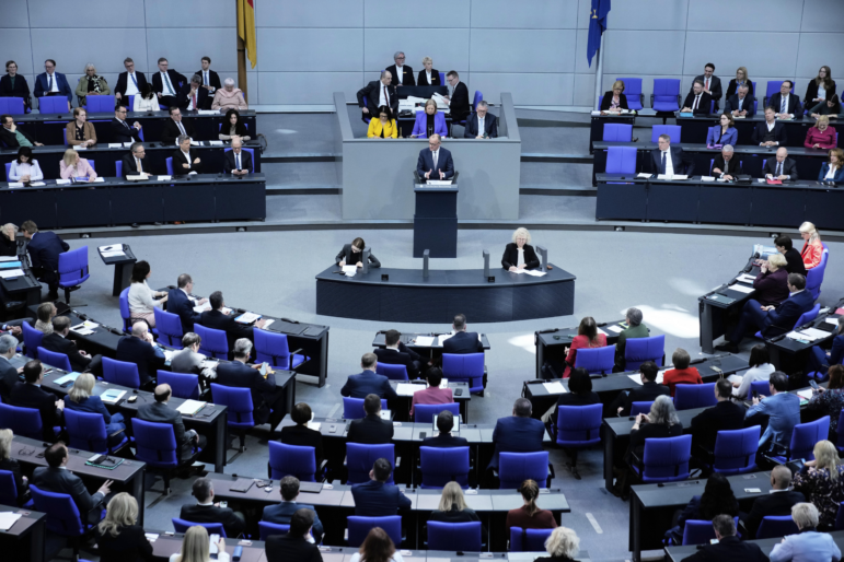 German opposition leader and Christian Democratic Union party chairman Friedrich Merz, right, speaks during a debate about loosening the country's debt rules in the Bundestag in Berlin, Germany, Tuesday.