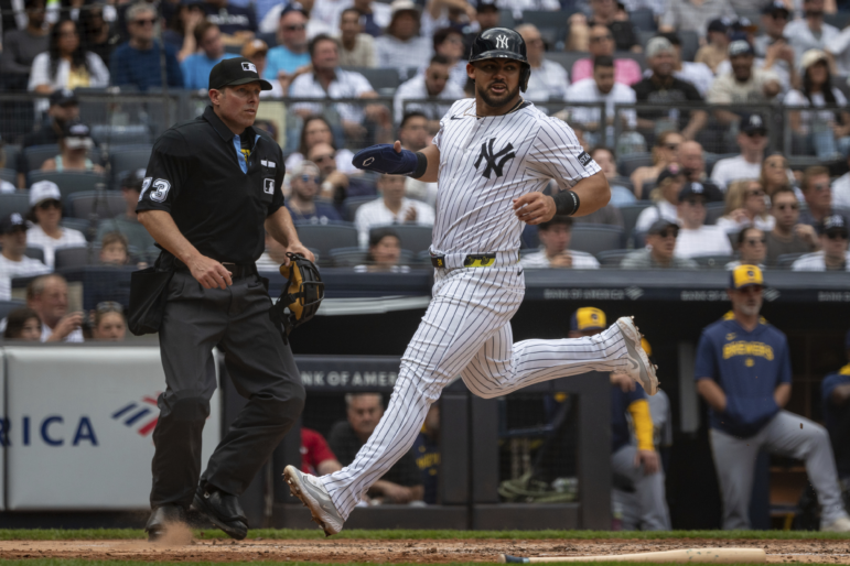 New York Yankees' Jasson Domínguez (24) scores during the third inning of a baseball game against the Milwaukee Brewers, Saturday, March 29, 2025, in New York. (AP Photo/Angelina Katsanis)