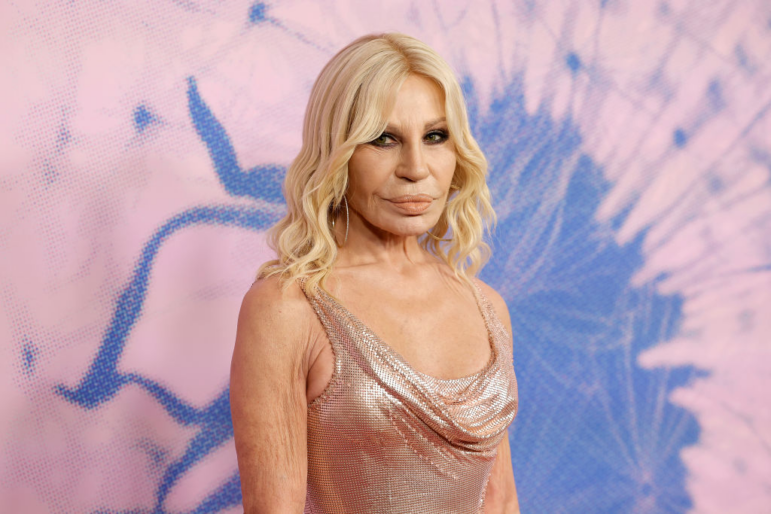 The fashion designer and socialite will be stepping down as Versace's creative director.