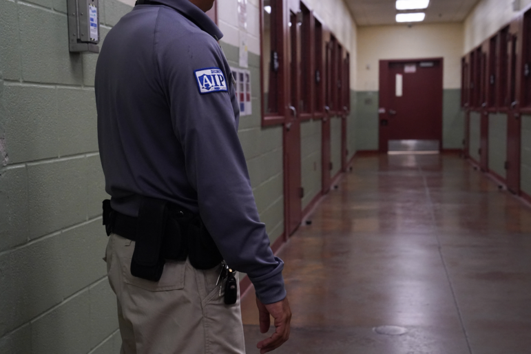 A security guard poses during a media tour of the Port Isabel Detention Center hosted by ICE in Los Fresnos, Texas in 2024. The Trump administration seeks to reopen family detention centers in the state.