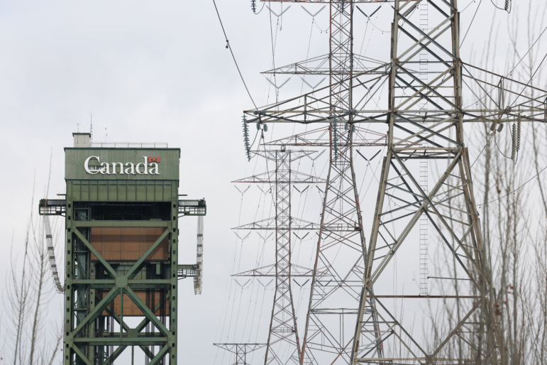 Power lines run near a bridge in Hamilton, Ontario, on Feb. 4. This week, Ontario's leader threatened a surcharge on Canadian electricity sold in some U.S. states in retaliation for President Trump's tariffs.