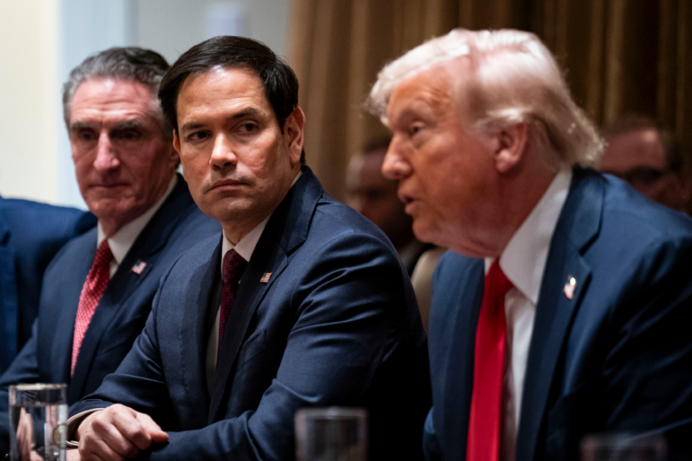 Doug Burgum, US secretary of the interior, from left, Marco Rubio, US secretary of state, and US President Donald Trump during a cabinet meeting at the White House in Washington, DC, US, on Wednesday, Feb. 26, 2025. Elon Musk's demand that more than two million federal employees defend their work is facing pushback from other powerful figures in the Trump administration, in a sign that the billionaire's brash approach to overhauling the government is creating division.