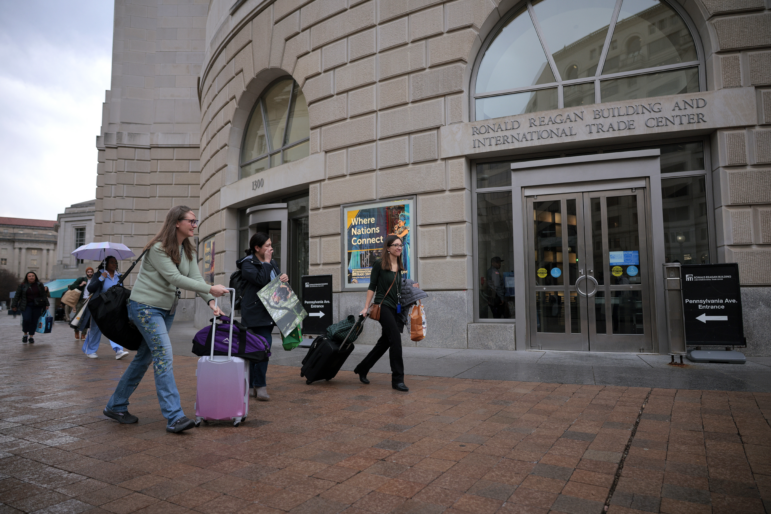 Former U.S. Agency for International Development employees terminated after the Trump administration effectively dismantled the agency collect their personal belongings at USAID headquarters on Feb. 27 in Washington, D.C.