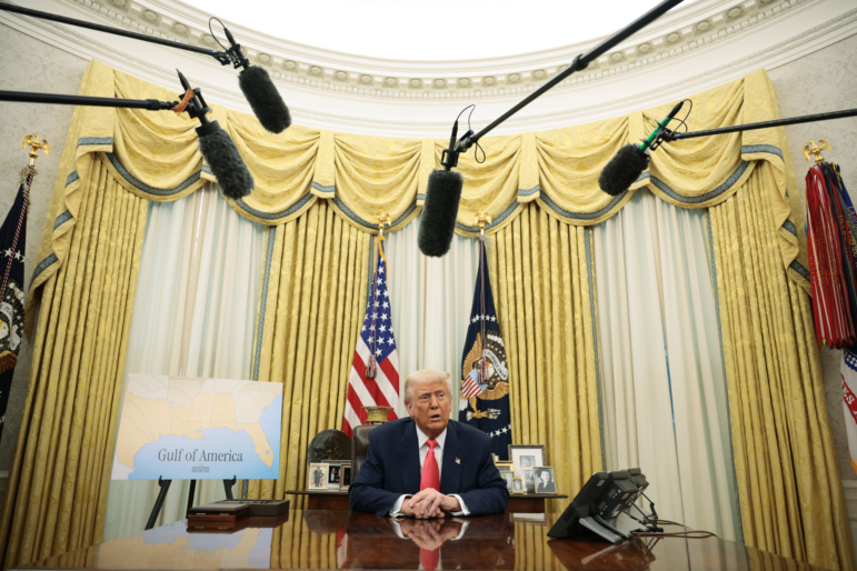 President Trump speaks as he signs executive orders in the Oval Office on March 6, including the order against the law firm Perkins Coie.
