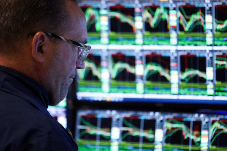 A trader works on the floor of the New York Stock Exchange (NYSE) at the opening bell in New York City on March 10, 2025. (Photo by CHARLY TRIBALLEAU/AFP via Getty Images)