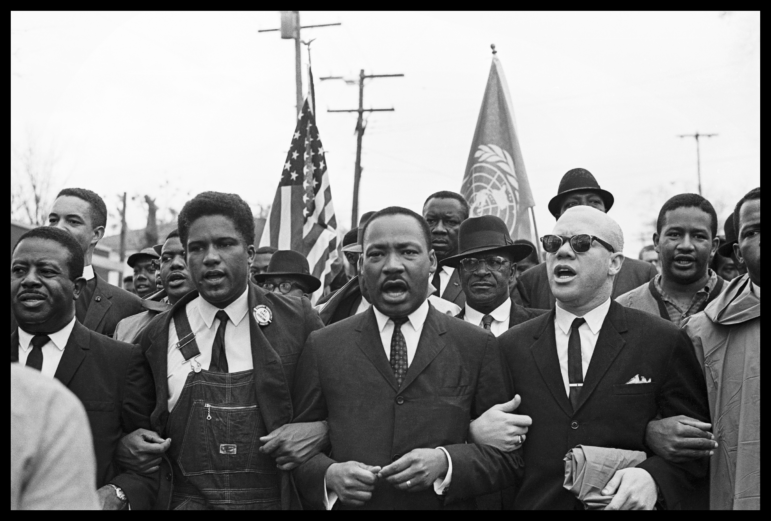 Rev. Ralph Abernathy, James Forman, Dr. Martin Luther King Jr. and Rev. Jesse Douglas lead the voting rights march to the Montgomery County Courthouse.