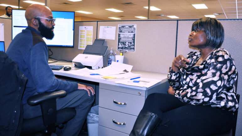 Employment security representative Chancellor Maryland helps Margaret Jenkins create a resume and tells her about resources available through the Birmingham Career Center.